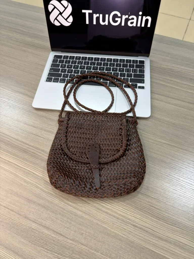 Brown rounded woven bag with a front flap and long strap (TG-90781)