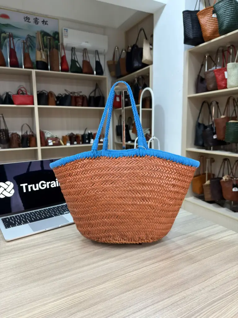Tan woven basket-shaped tote with blue handles and a blue upper edge (TG-90803)