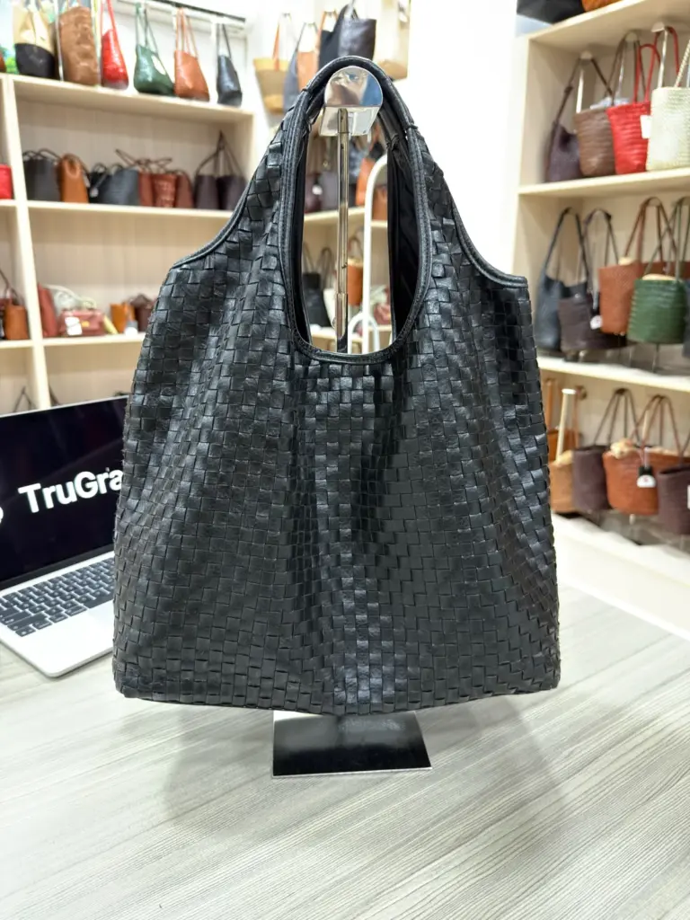 Black woven tote with broad handles and a curved opening (TG-90835)