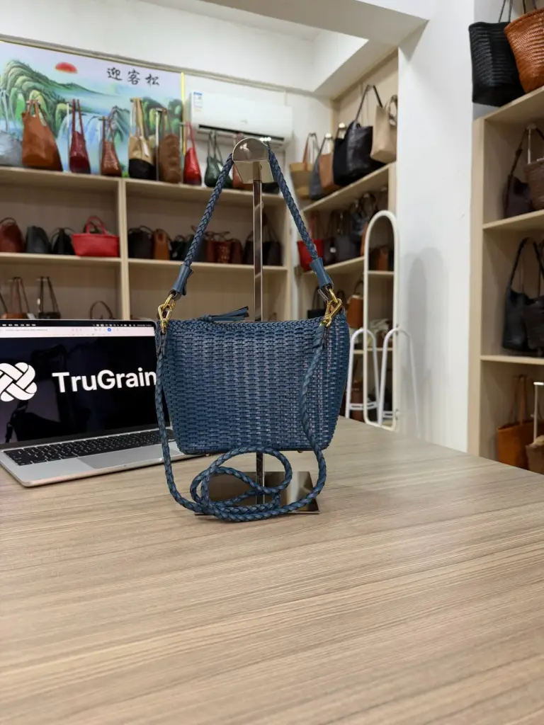 Blue woven shoulder bag with a long strap and gold-tone attachments (TG-90874)