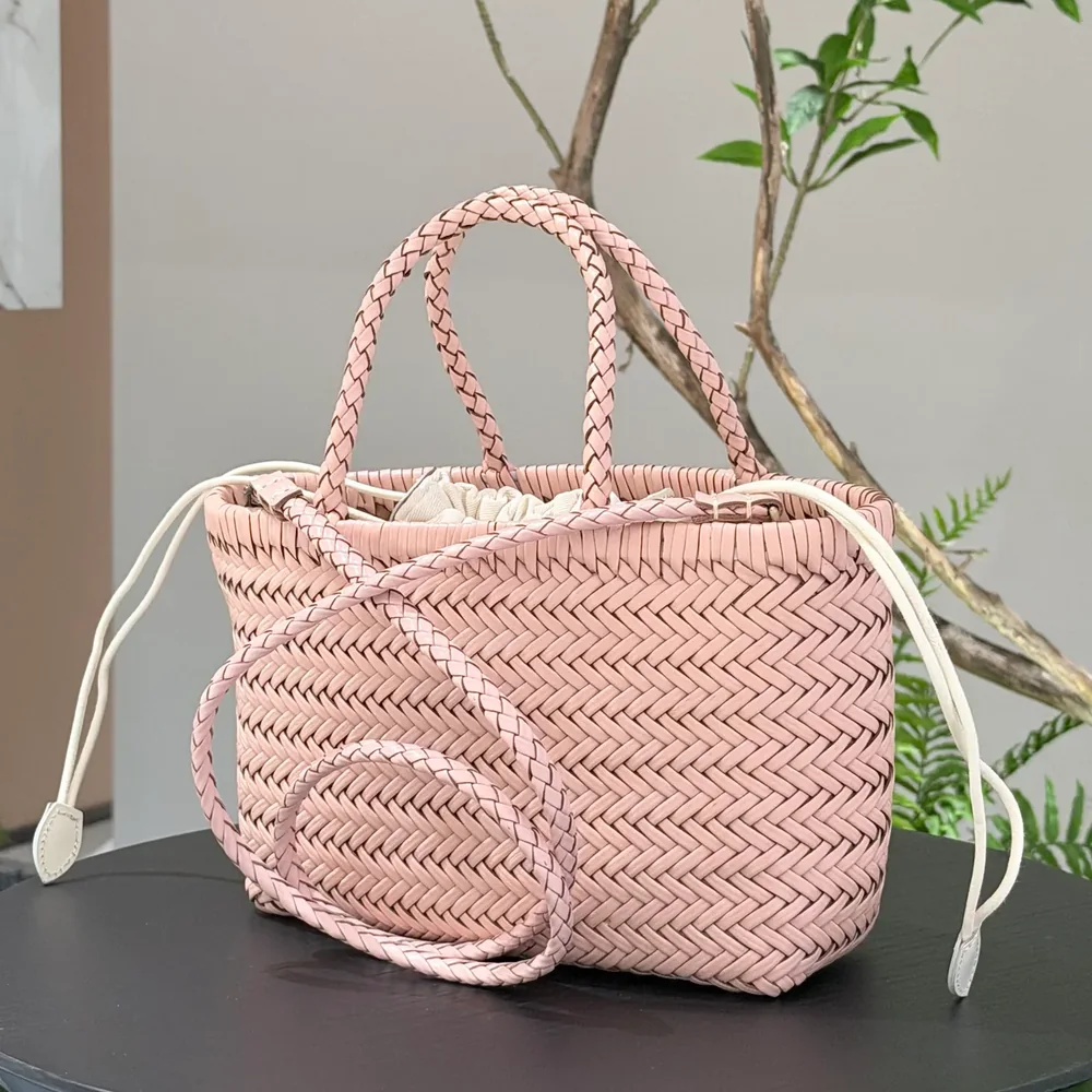 TG-90032 pink woven leather handbag with rounded braided handles and diagonal woven texture, three-quarter view