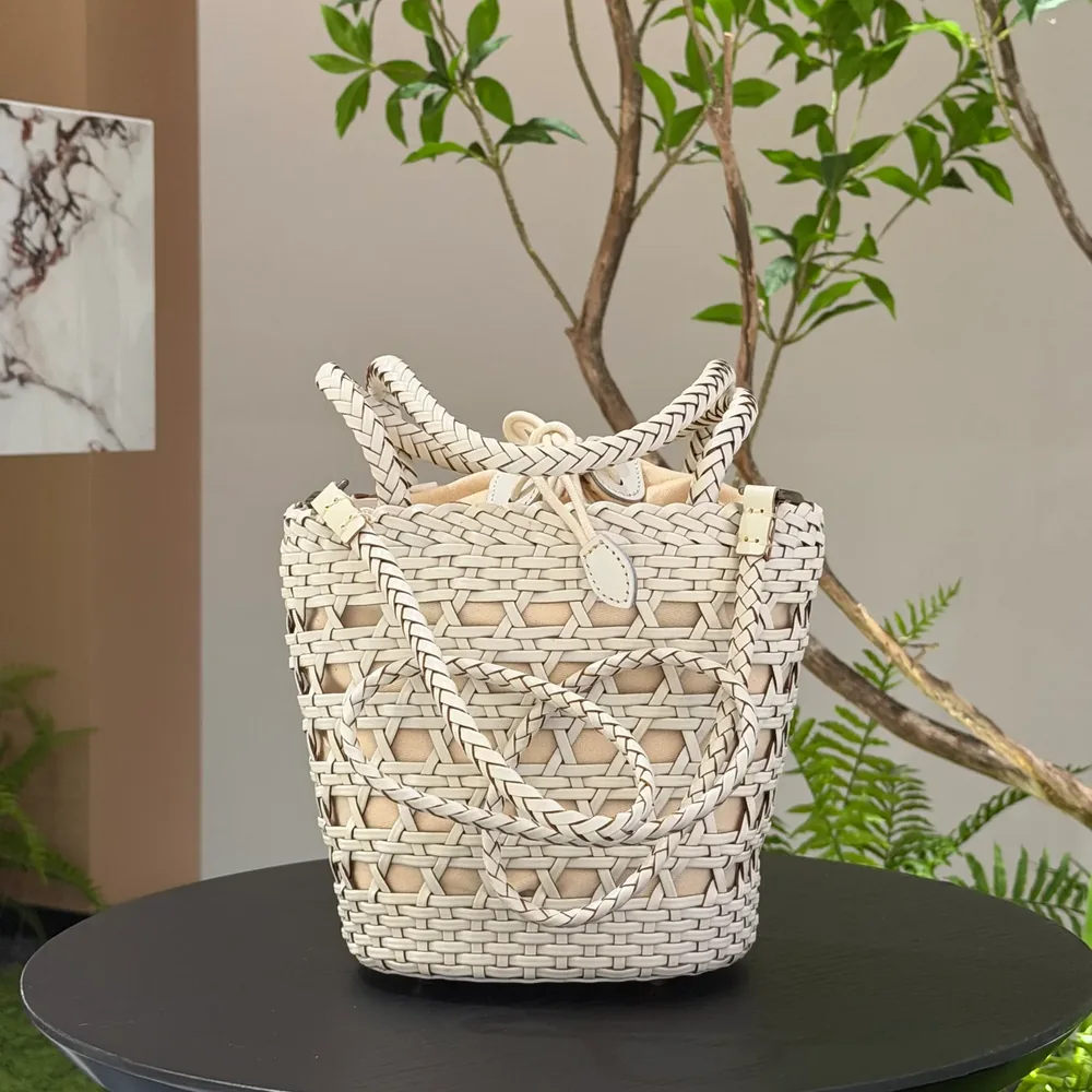 TG-90042 cream open-weave leather bucket bag with two handles and fabric lining, front view