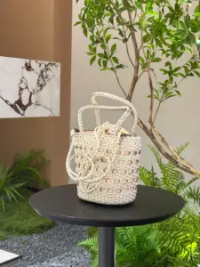 Open-weave leather bucket bag in cream