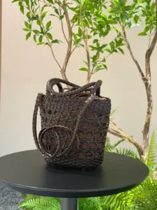 Open-weave leather bucket bag in dark brown