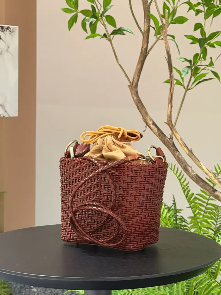 Small woven leather bag in Brown (shown), with a square body, one handle and a detachable long shoulder strap
