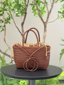 Woven leather handbag in brown