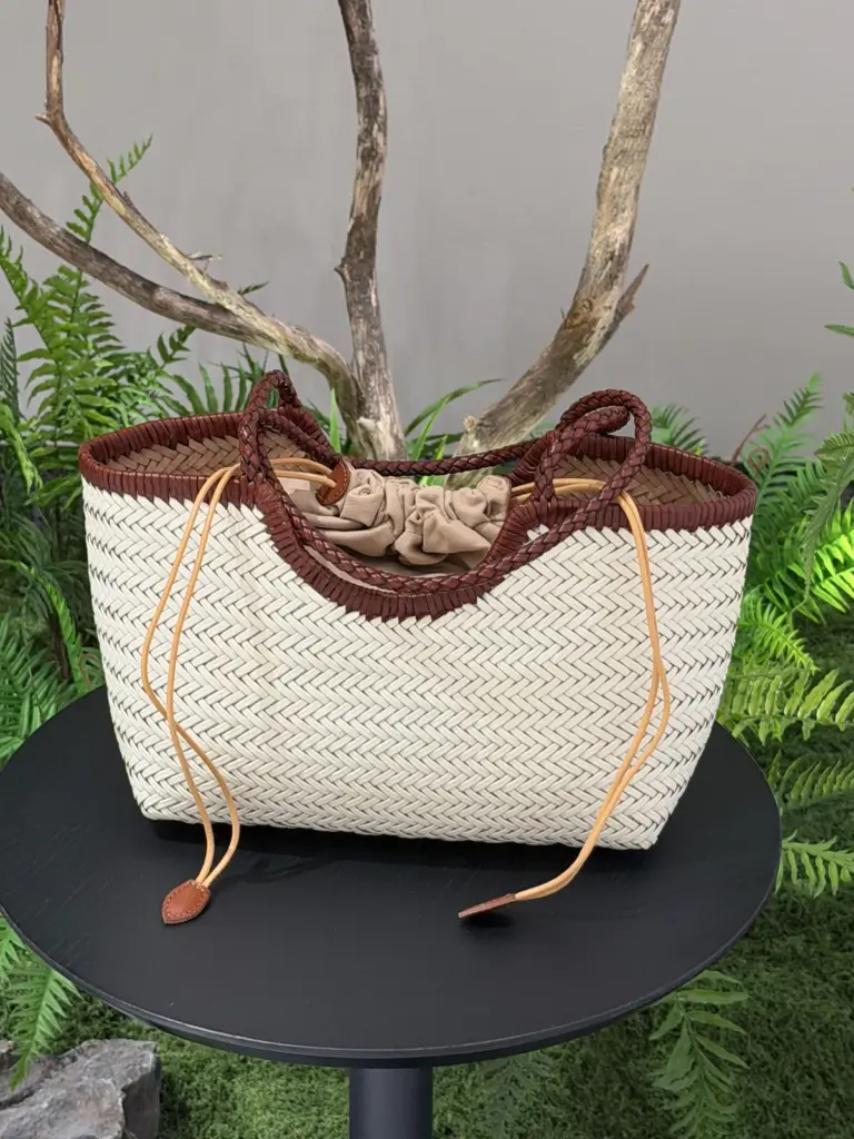 Cream and Brown (two-tone) woven leather tote with two brown handles and fabric-pouch drawcords
